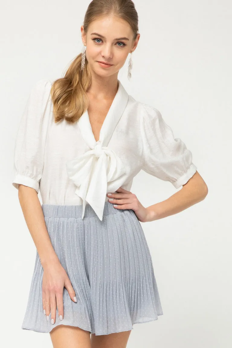 Polka dot pleated flared shorts